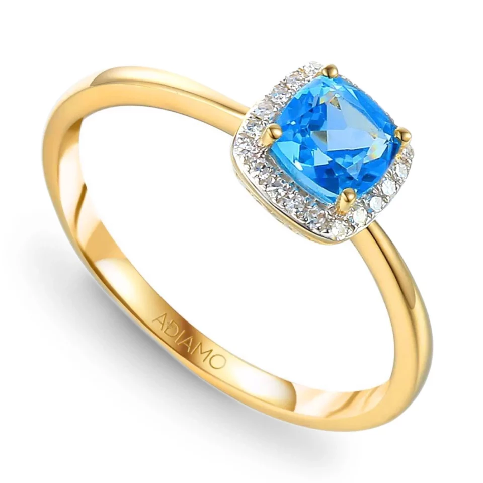 Pierścionek z niebieskim topazem i diamentami